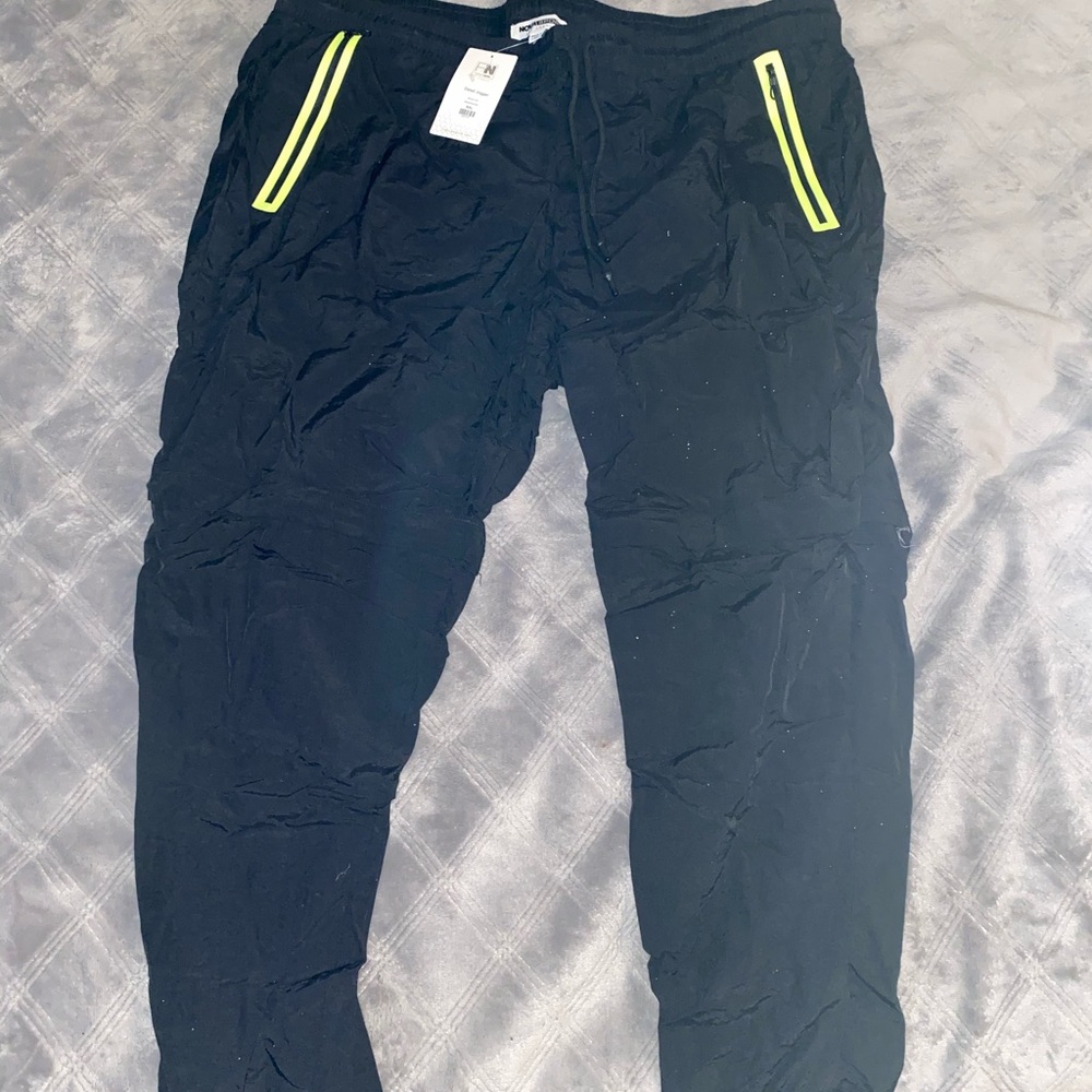 Windbreaker joggers in black and neon yellow